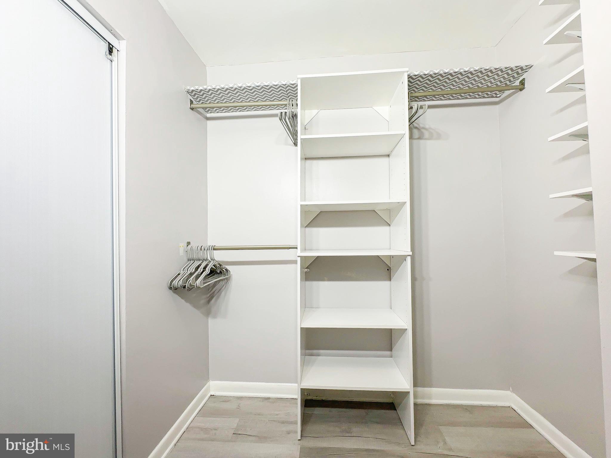 614 Sligo Avenue, Unit 405 Silver Spring, MD 20910 - Photo 18 of 31 a view of walk in closet with empty racks
