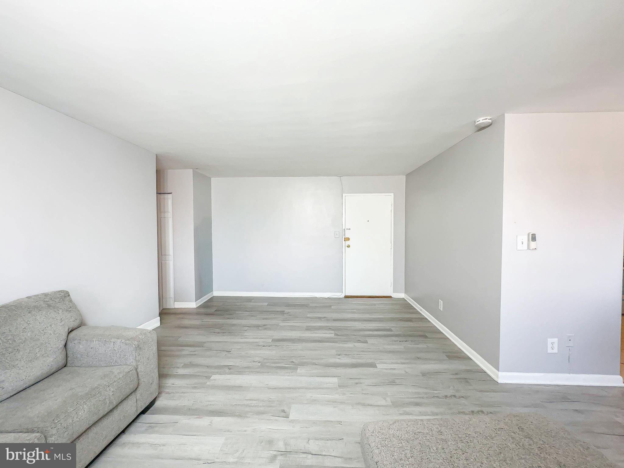 614 Sligo Avenue, Unit 405 Silver Spring, MD 20910 - Photo 6 of 31 a view of livingroom with furniture and wooden floor