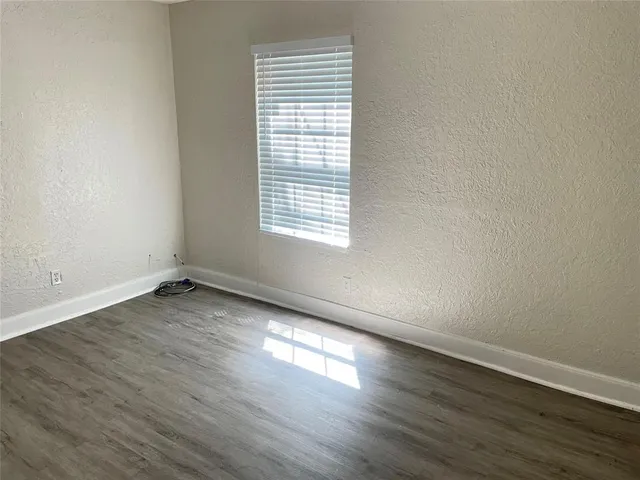 a bath room with a toilet and a bath tub