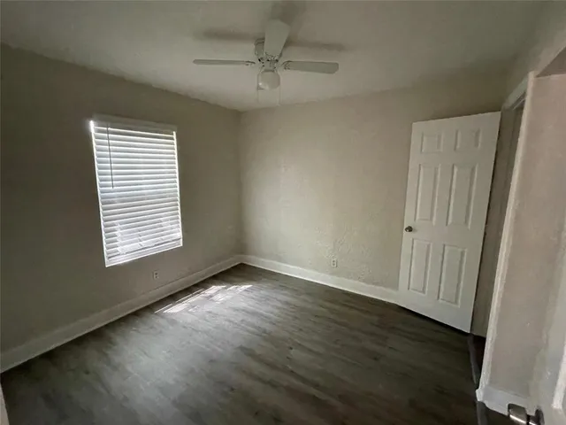 a bathroom with a sink vanity toilet and mirror