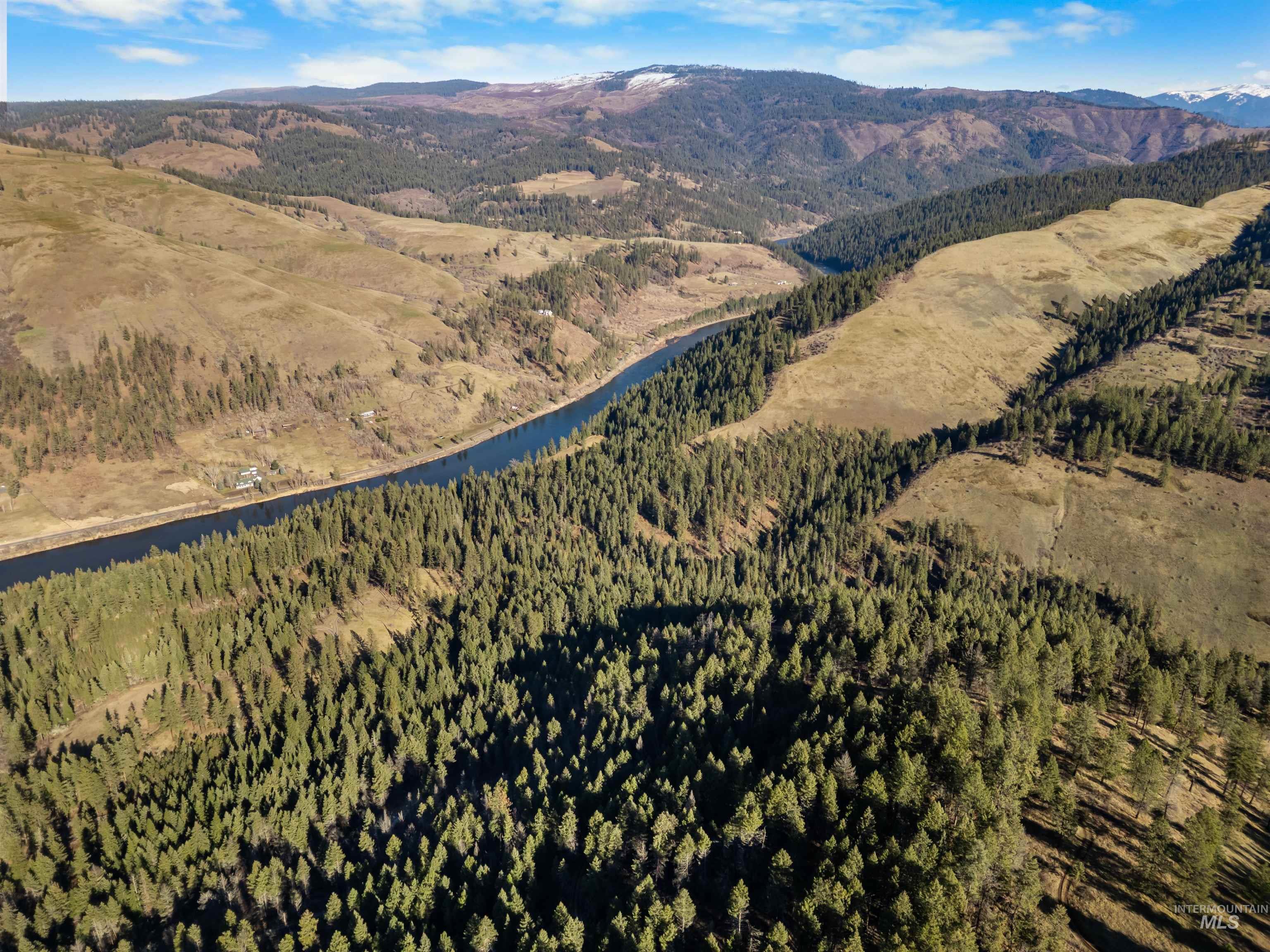 216 Ulmer Road Kooskia, ID 83539 - Photo 11 of 47 Drone / aerial view of a water and mountain view and a forest