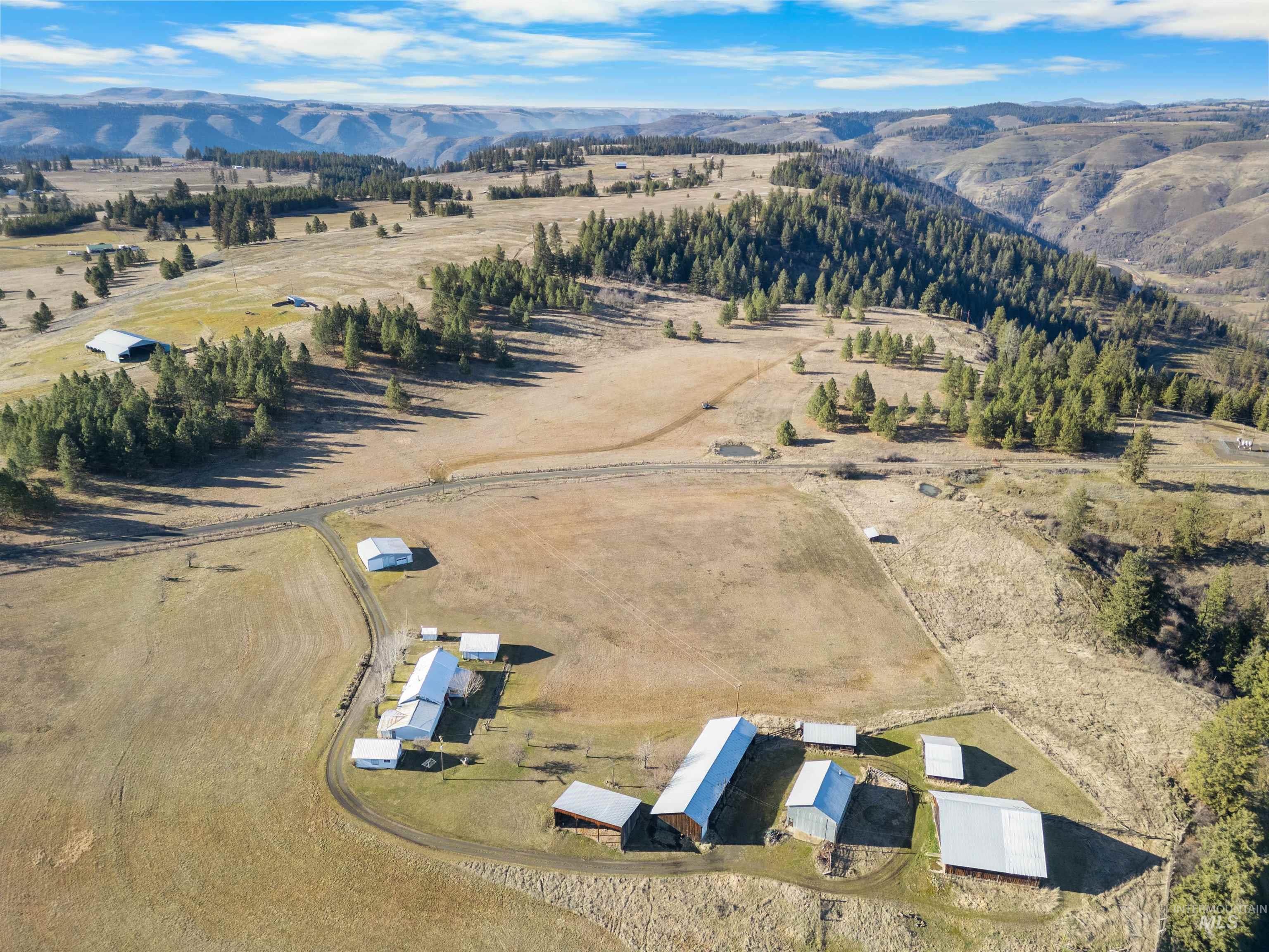 216 Ulmer Road Kooskia, ID 83539 - Photo 5 of 47 Aerial view of sparsely populated area featuring a mountainous background