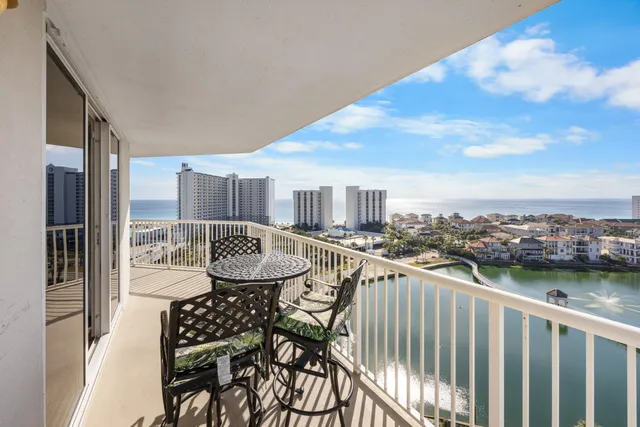 a view of a balcony with chair and city view