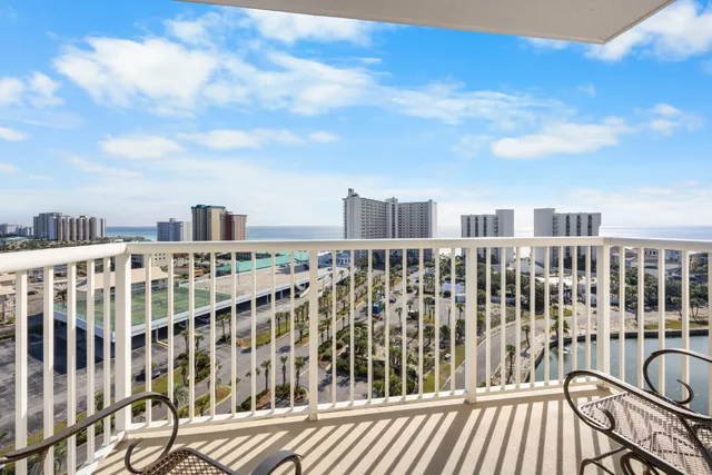 a view of a balcony with wooden fence
