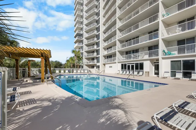 a view of a swimming pool with a lounge chairs