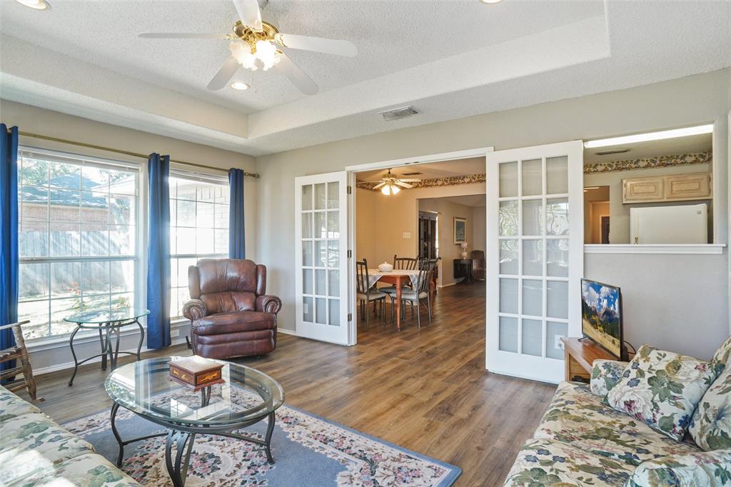 1116 Shadow Ridge Drive Azle, TX 76020 - Photo 12 of 27 a living room with furniture and wooden floor