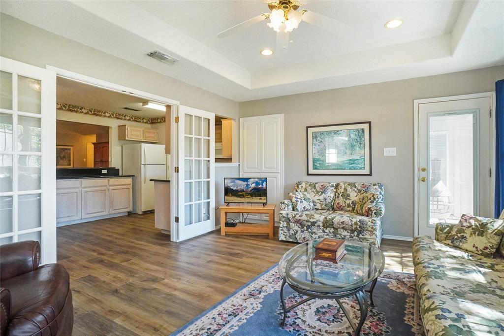 1116 Shadow Ridge Drive Azle, TX 76020 - Photo 13 of 27 a living room with furniture and a flat screen tv