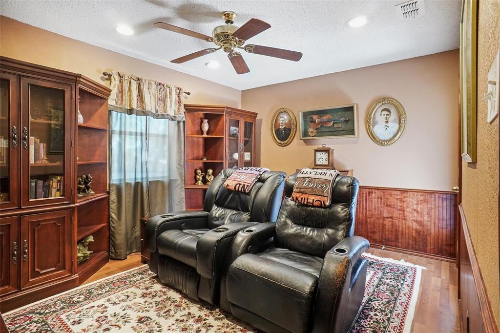 1116 Shadow Ridge Drive Azle, TX 76020 - Photo 19 of 27 a living room with furniture and a flat screen tv