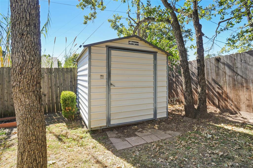 1116 Shadow Ridge Drive Azle, TX 76020 - Photo 26 of 27 a front view of a house with a yard