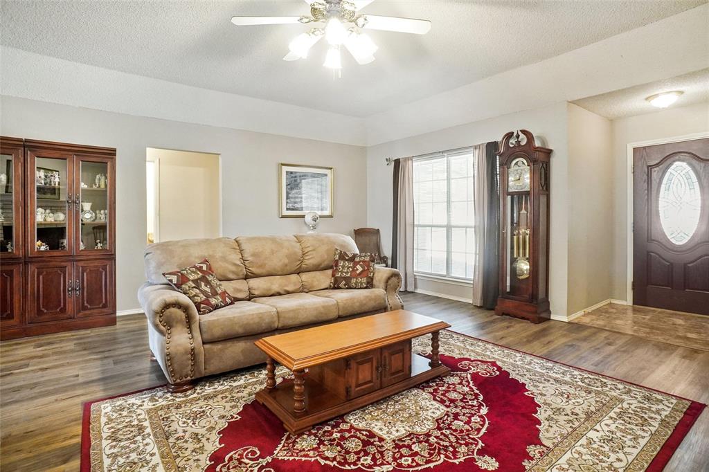 1116 Shadow Ridge Drive Azle, TX 76020 - Photo 5 of 27 a living room with furniture and a rug