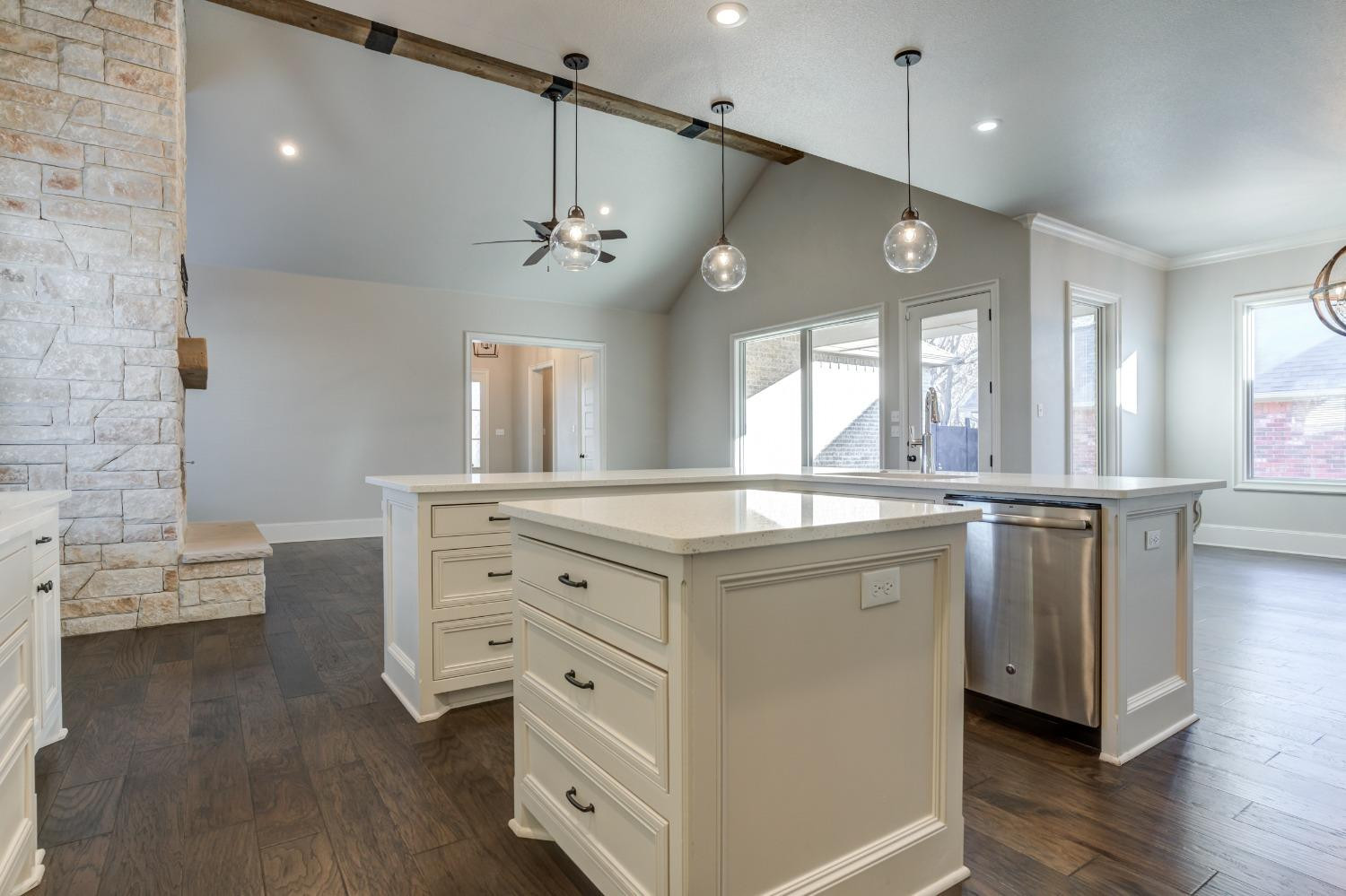 402 Topeka Avenue Lubbock, TX 79416 - Photo 13 of 41 a large white kitchen with a large counter space a sink and wooden floor