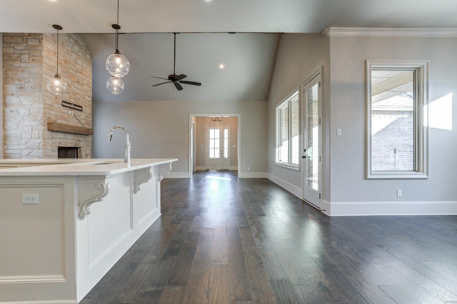 402 Topeka Avenue Lubbock, TX 79416 - Photo 16 of 41 a view of a kitchen with wooden floor and a window