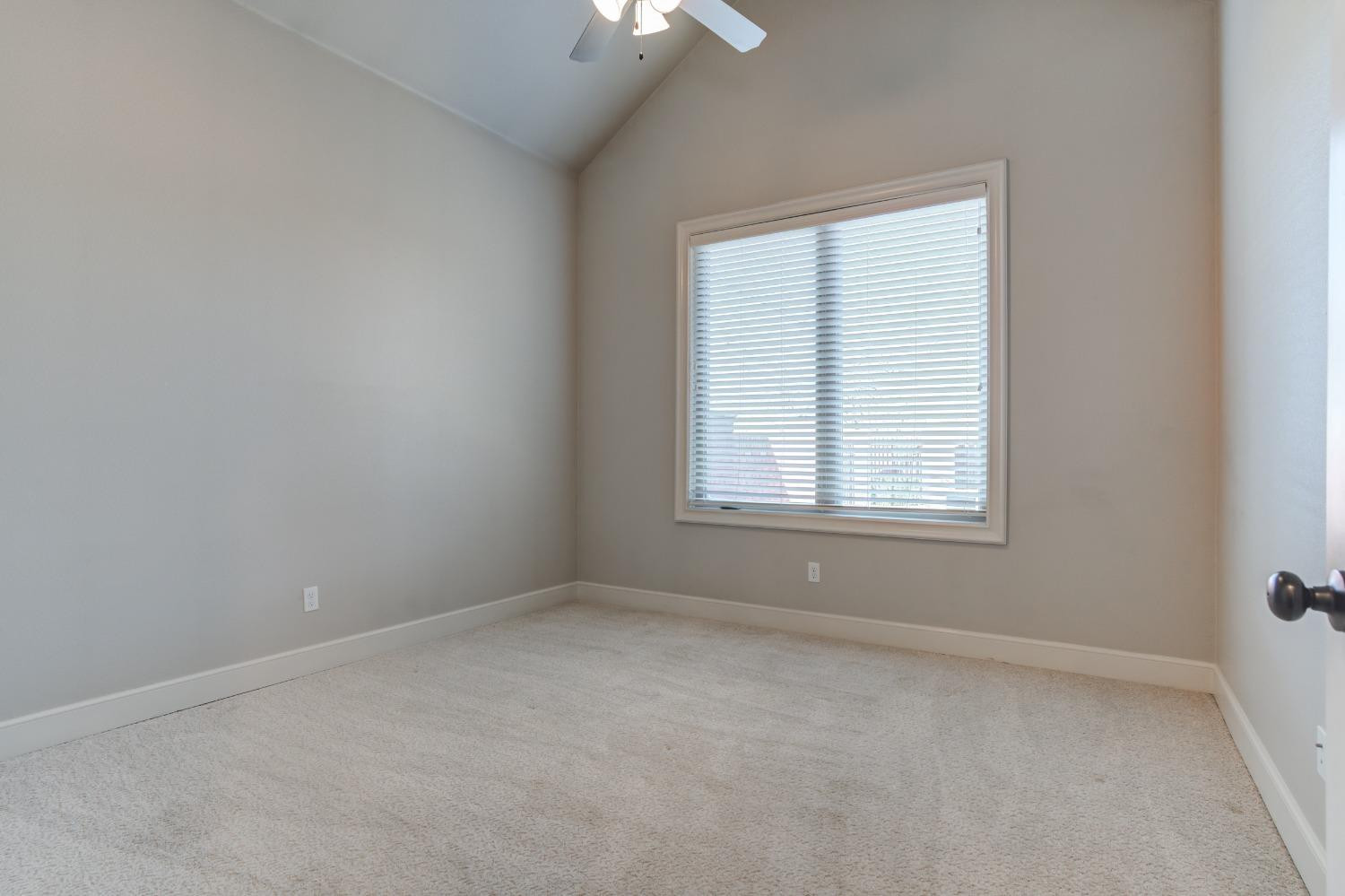 402 Topeka Avenue Lubbock, TX 79416 - Photo 22 of 41 an empty room with a window