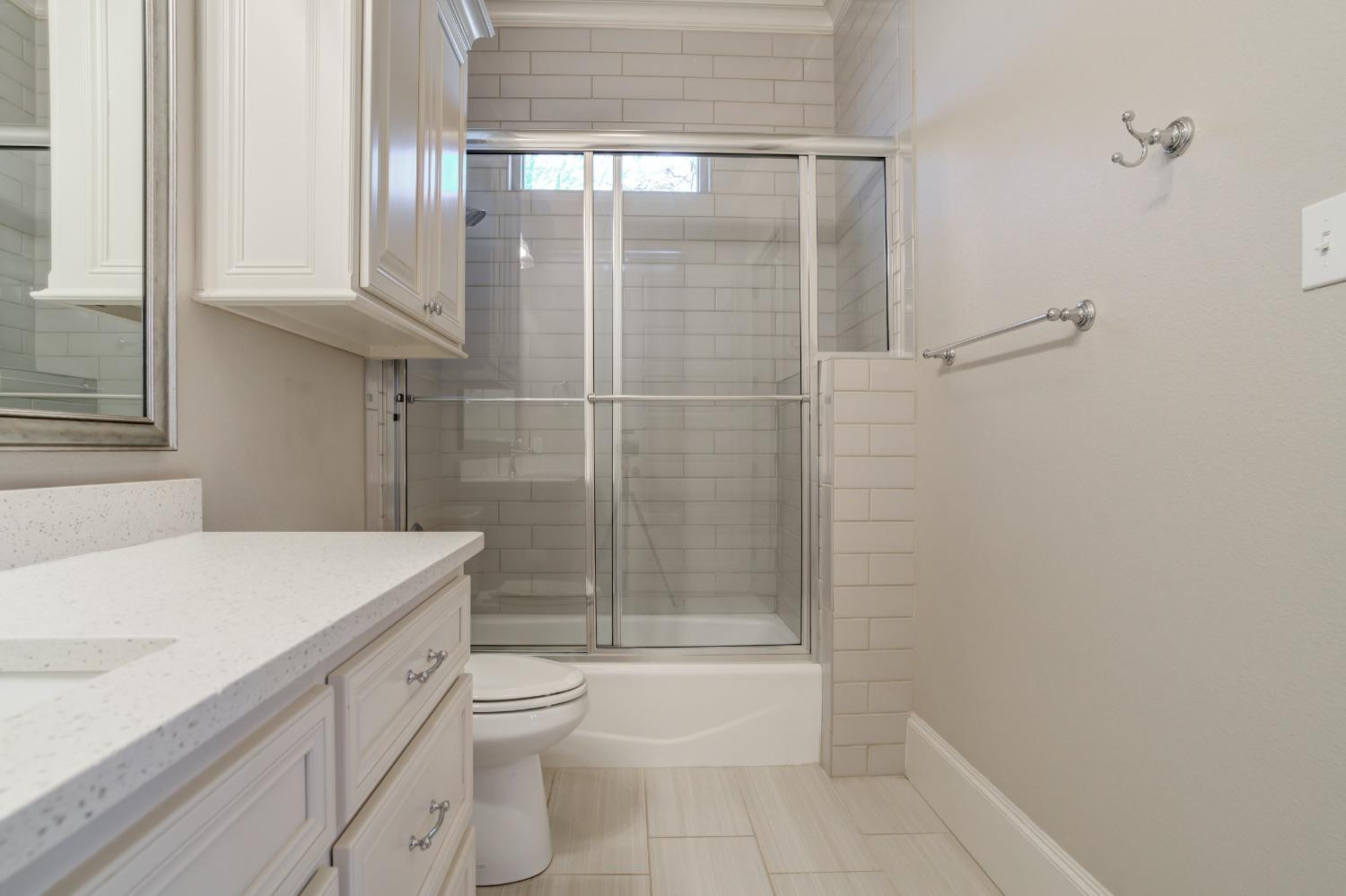 402 Topeka Avenue Lubbock, TX 79416 - Photo 25 of 41 a bathroom with a sink a toilet and shower