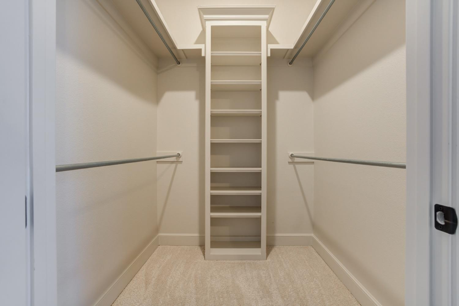 402 Topeka Avenue Lubbock, TX 79416 - Photo 28 of 41 a view of walk in closet with empty racks