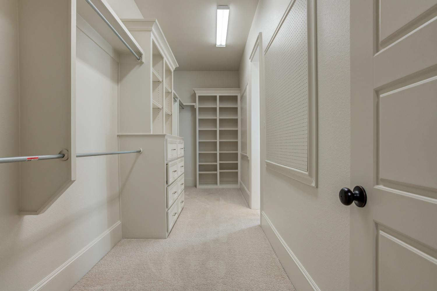 402 Topeka Avenue Lubbock, TX 79416 - Photo 29 of 41 a view of walk in closet with empty racks