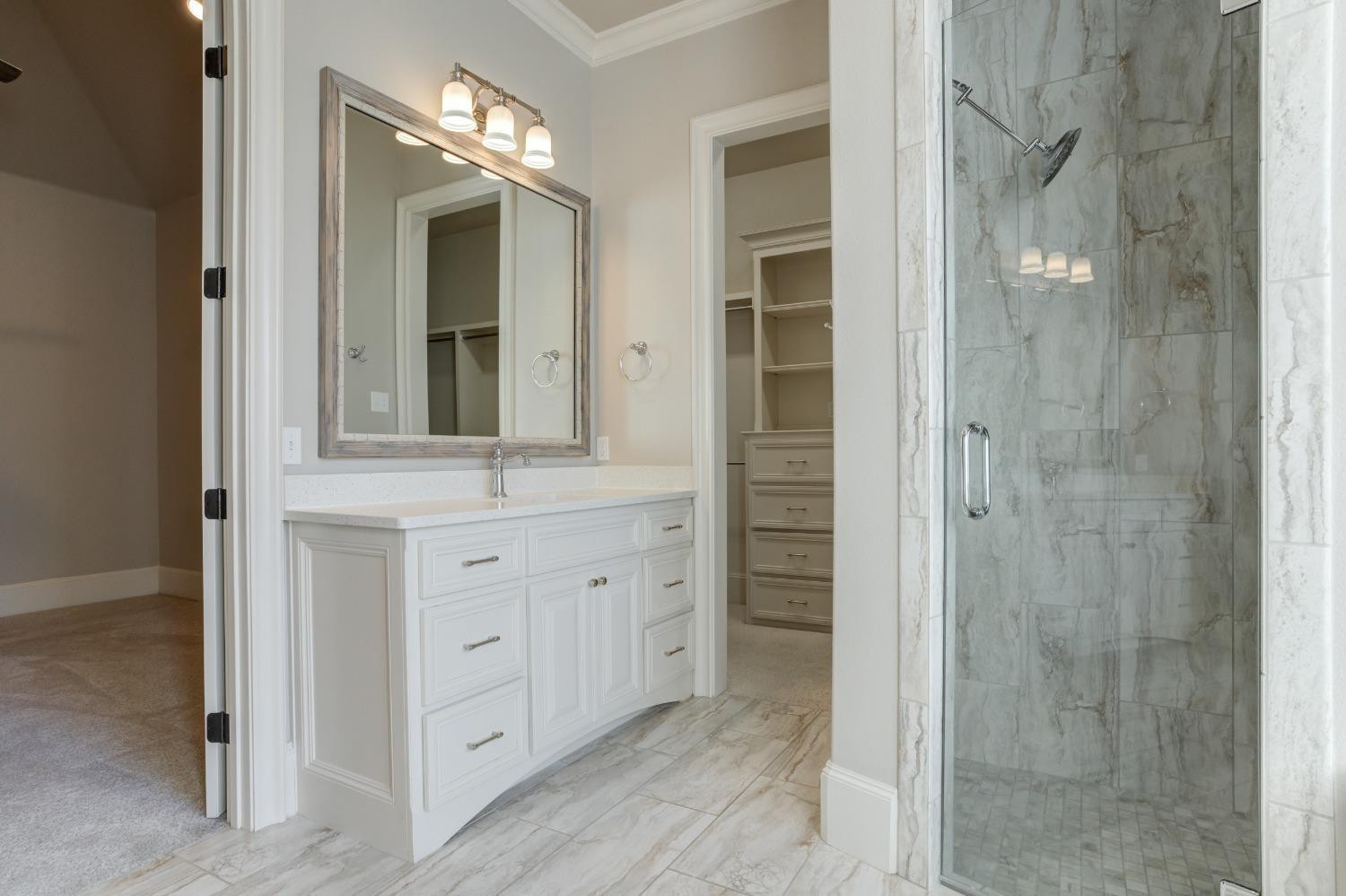 402 Topeka Avenue Lubbock, TX 79416 - Photo 35 of 41 a bathroom with a shower and a sink
