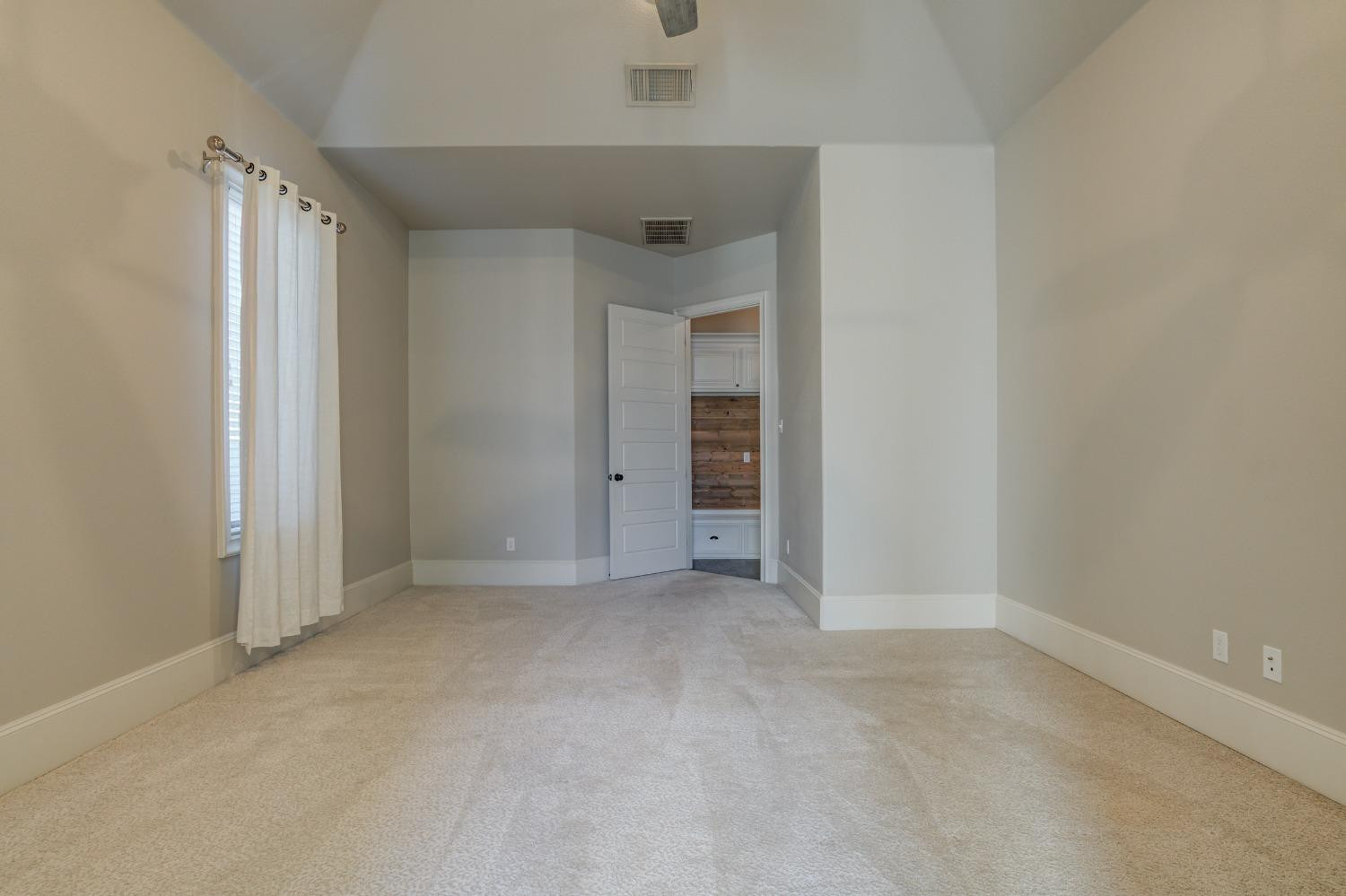 402 Topeka Avenue Lubbock, TX 79416 - Photo 40 of 41 an empty room with closet and a hallway