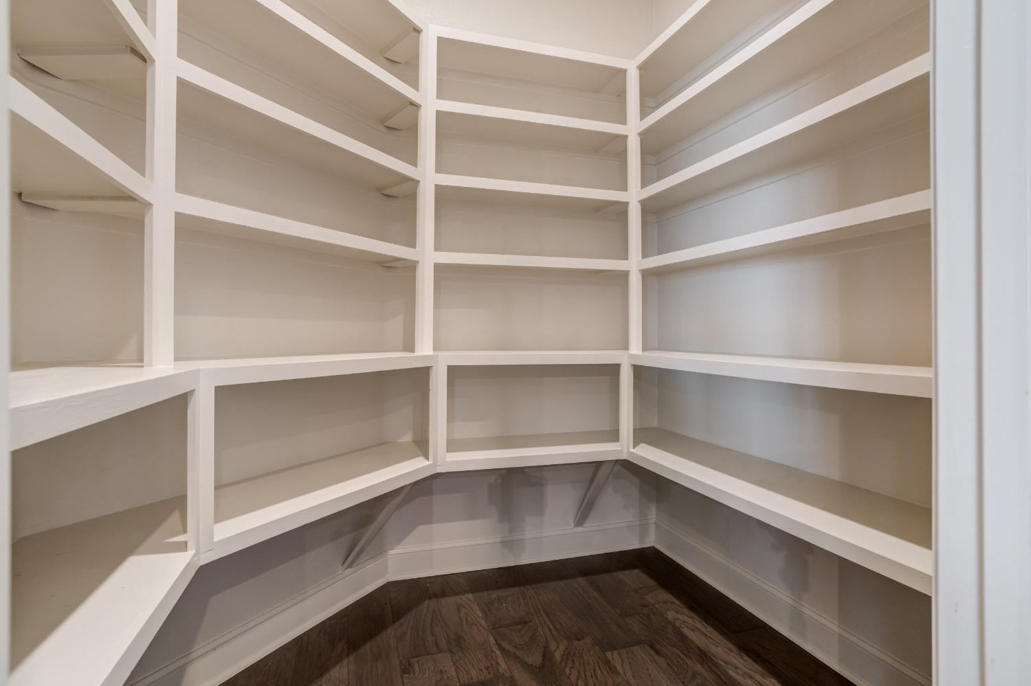 402 Topeka Avenue Lubbock, TX 79416 - Photo 41 of 41 a view of walk in closet with empty racks