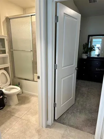 a bed room with a bed and a window