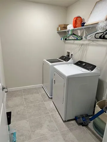 a bathroom with a granite countertop shower and toilet