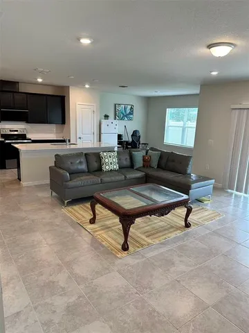 a living room with furniture and a rug