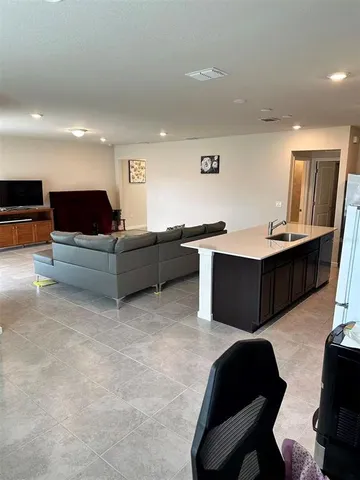 a living room with furniture and a table