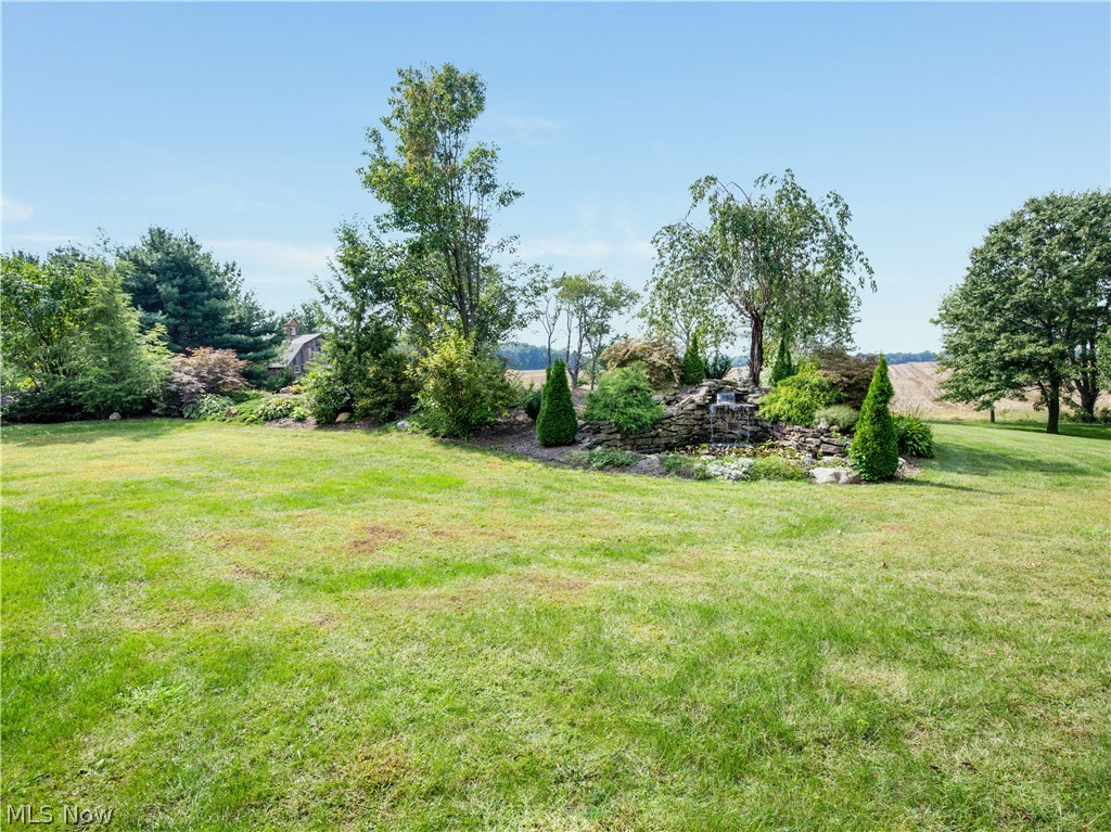 99 Kehner Road Mogadore, OH 44260 - Photo 3 of 35 Beautiful mature landscaping all around the property. The septic is located just beyond the landscaping-away from the home