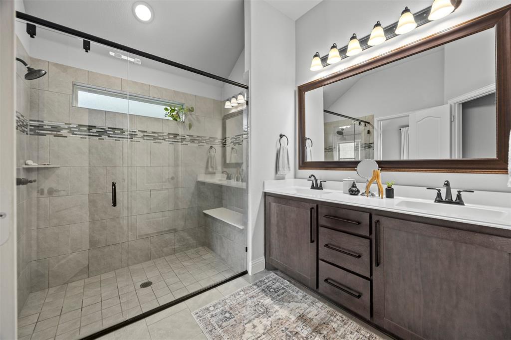 1084 Imperial Eagle Road Alvarado, TX 76009 - Photo 25 of 39 a bathroom with a shower sink and mirror