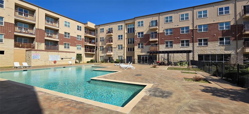 1100 West Trinity Mills Road, Unit 2045 Carrollton, TX 75006 - Photo 17 of 20 Community pool with a patio area and a pergola