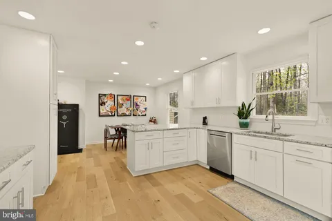 a large kitchen with a lot of counter space and a sink