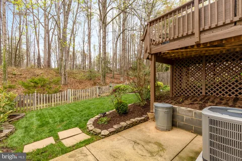 a view of a backyard with sitting area