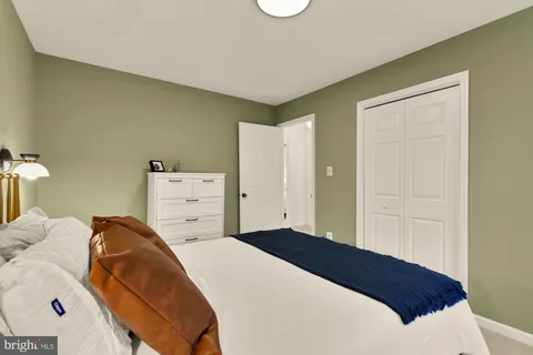a bedroom with a bed and a cabinets