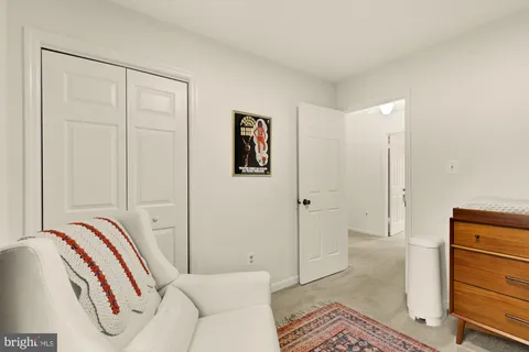 a bedroom with a bed and a cabinets