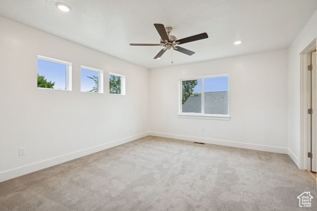 1615 North Angel Street, Unit E Layton, UT 84041 - Photo 21 of 42 Unfurnished room featuring light carpet, recessed lighting, and ceiling fan