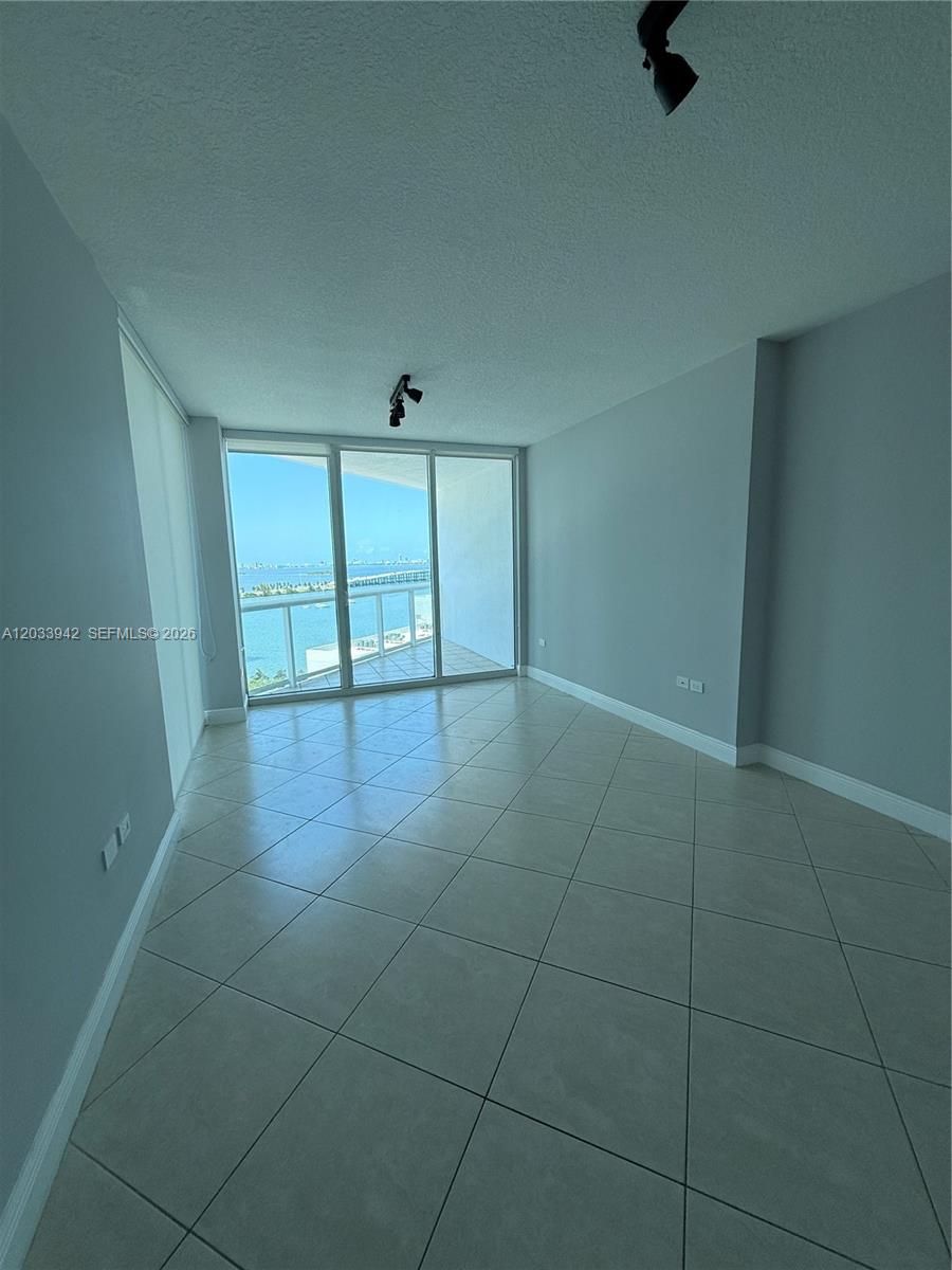 480 Northeast 30th Street, Unit 1504 Miami, FL 33137 - Photo 6 of 14 Bay view from living room & dinning room