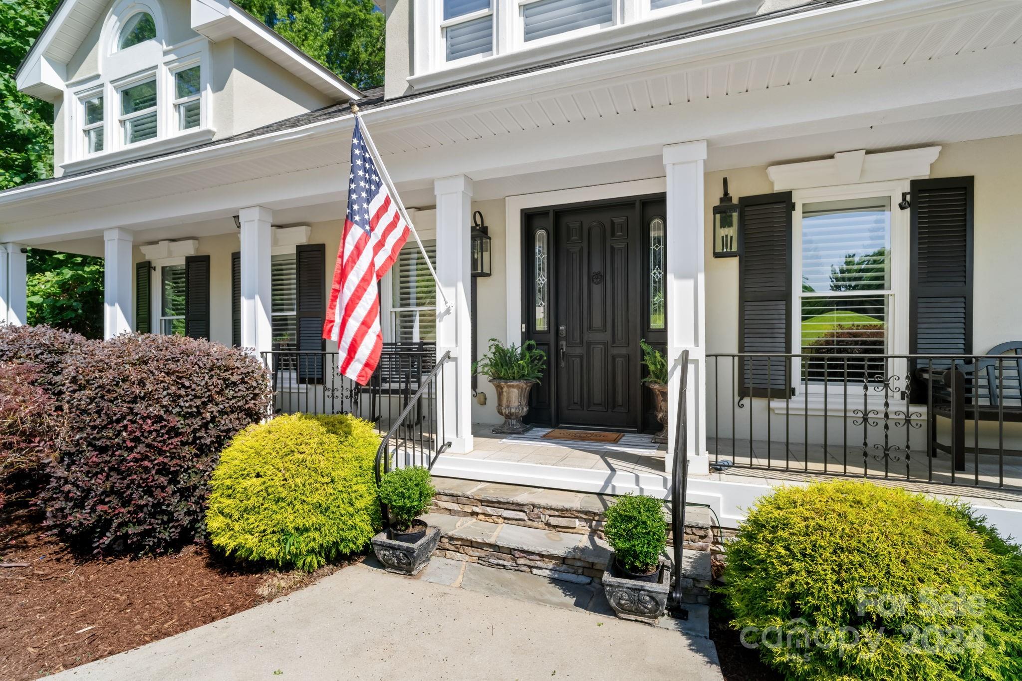 2049 Rocky Stream Road York, SC 29745 - Photo 2 of 47 a front view of a house with garden