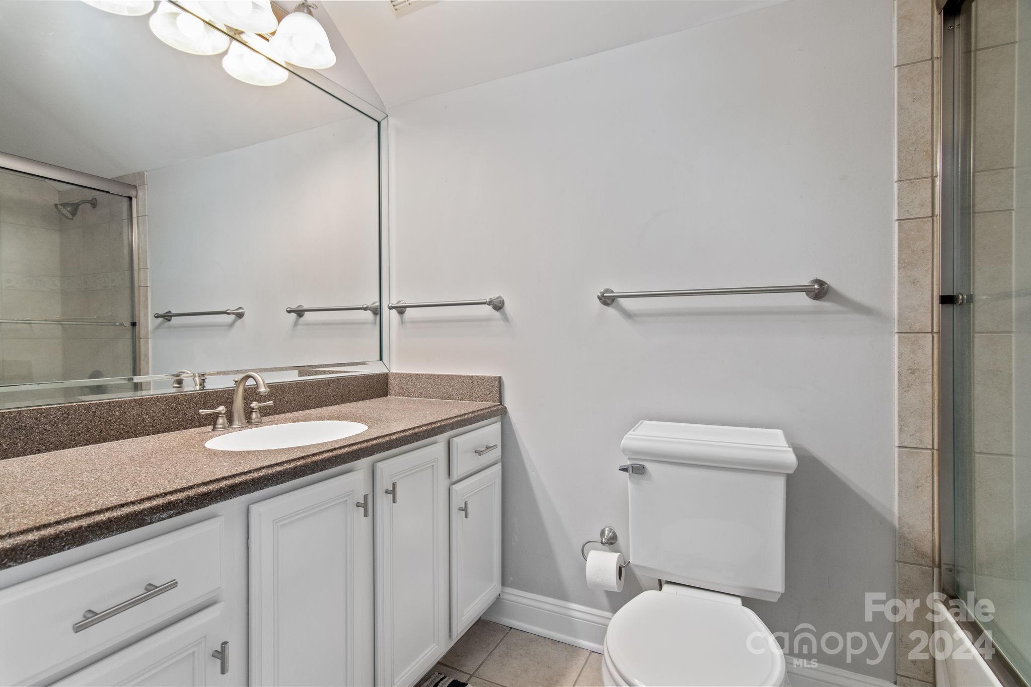 2049 Rocky Stream Road York, SC 29745 - Photo 22 of 47 a bathroom with a granite countertop toilet sink and mirror