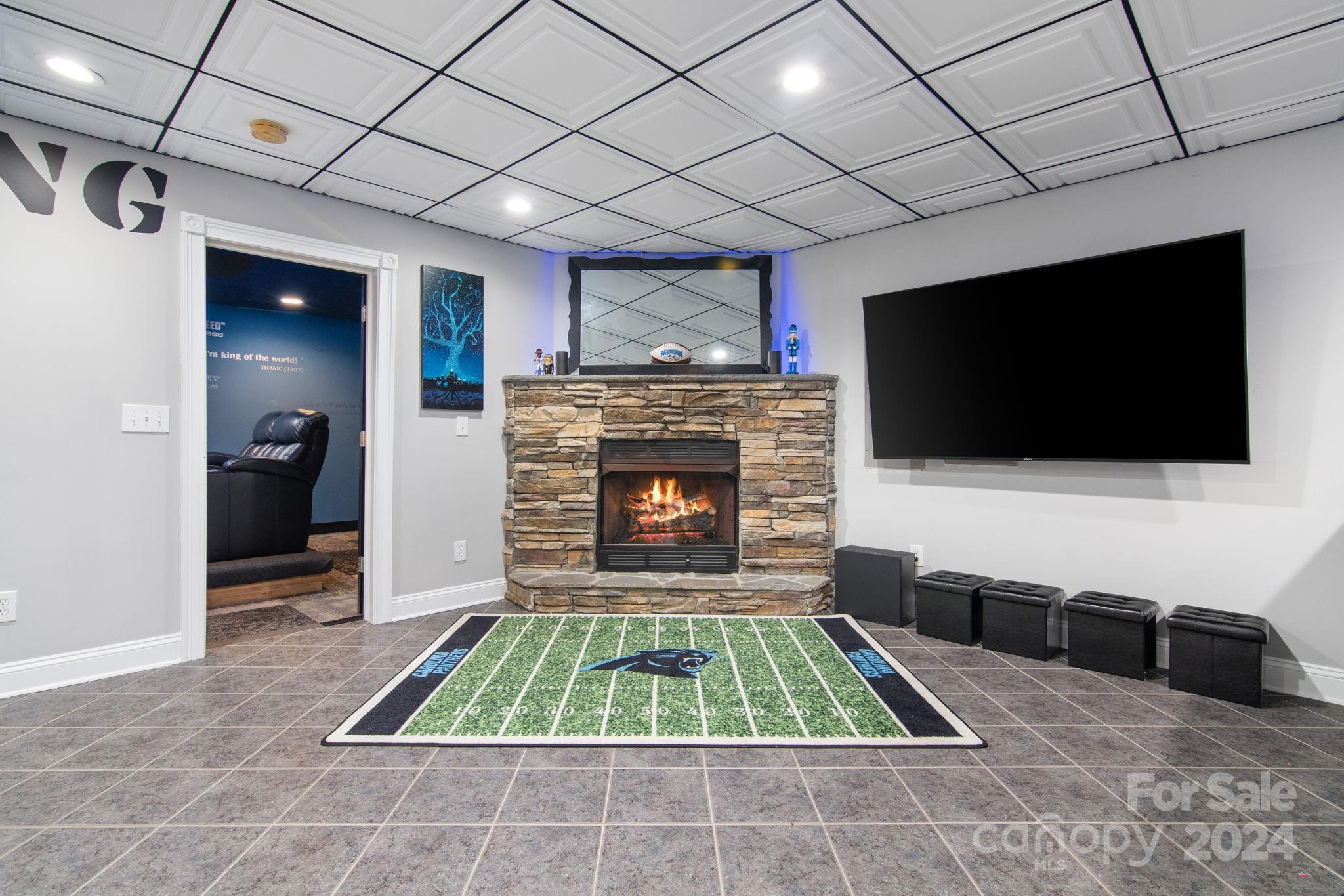 2049 Rocky Stream Road York, SC 29745 - Photo 26 of 47 a living room with furniture a flat screen tv and a fireplace