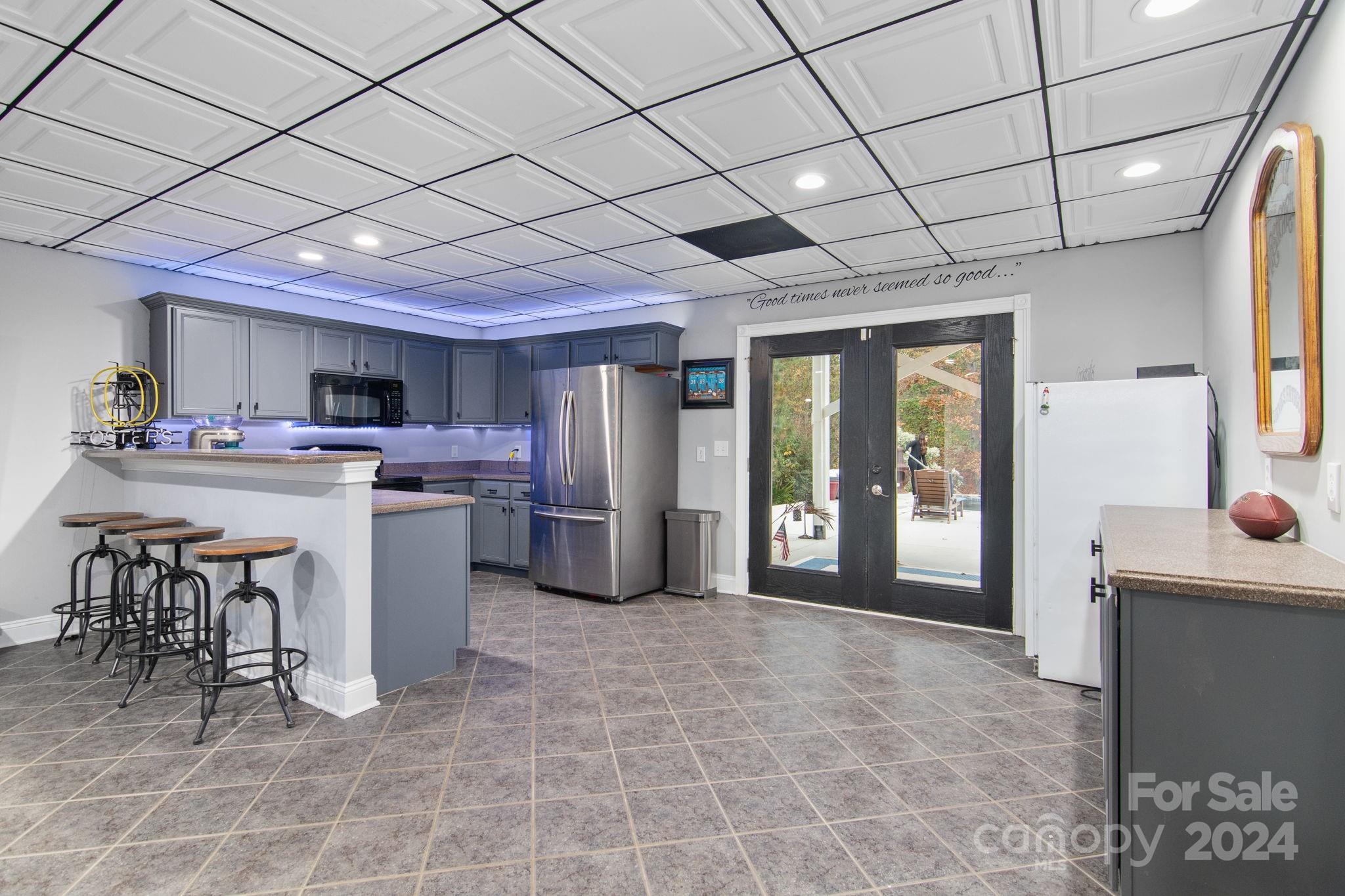 2049 Rocky Stream Road York, SC 29745 - Photo 27 of 47 a open kitchen with stainless steel appliances granite countertop a stove a refrigerator a sink dishwasher and a dining table with the view of bathroom