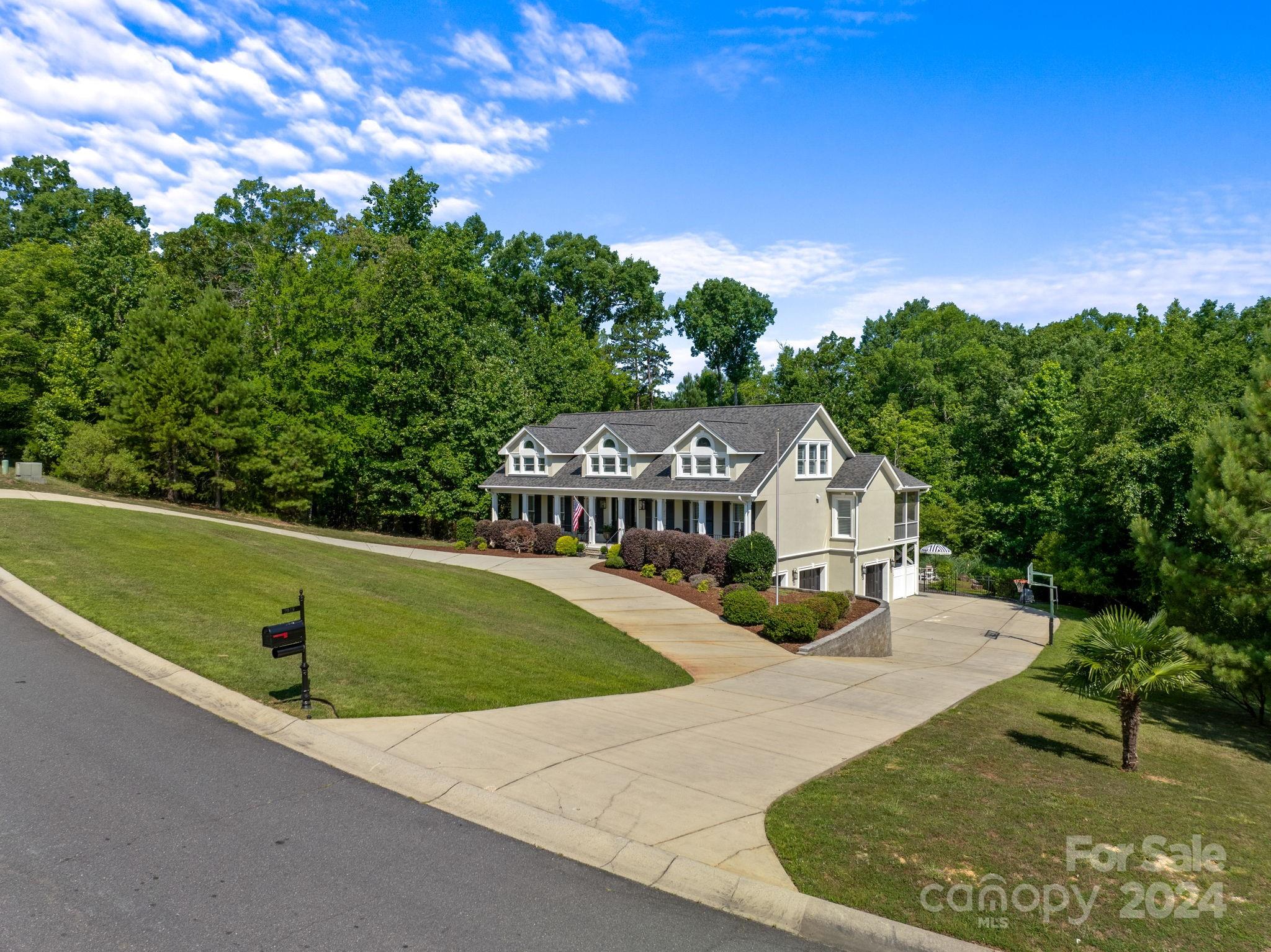 2049 Rocky Stream Road York, SC 29745 - Photo 41 of 47 an aerial view of a house with swimming pool garden and trees in the background