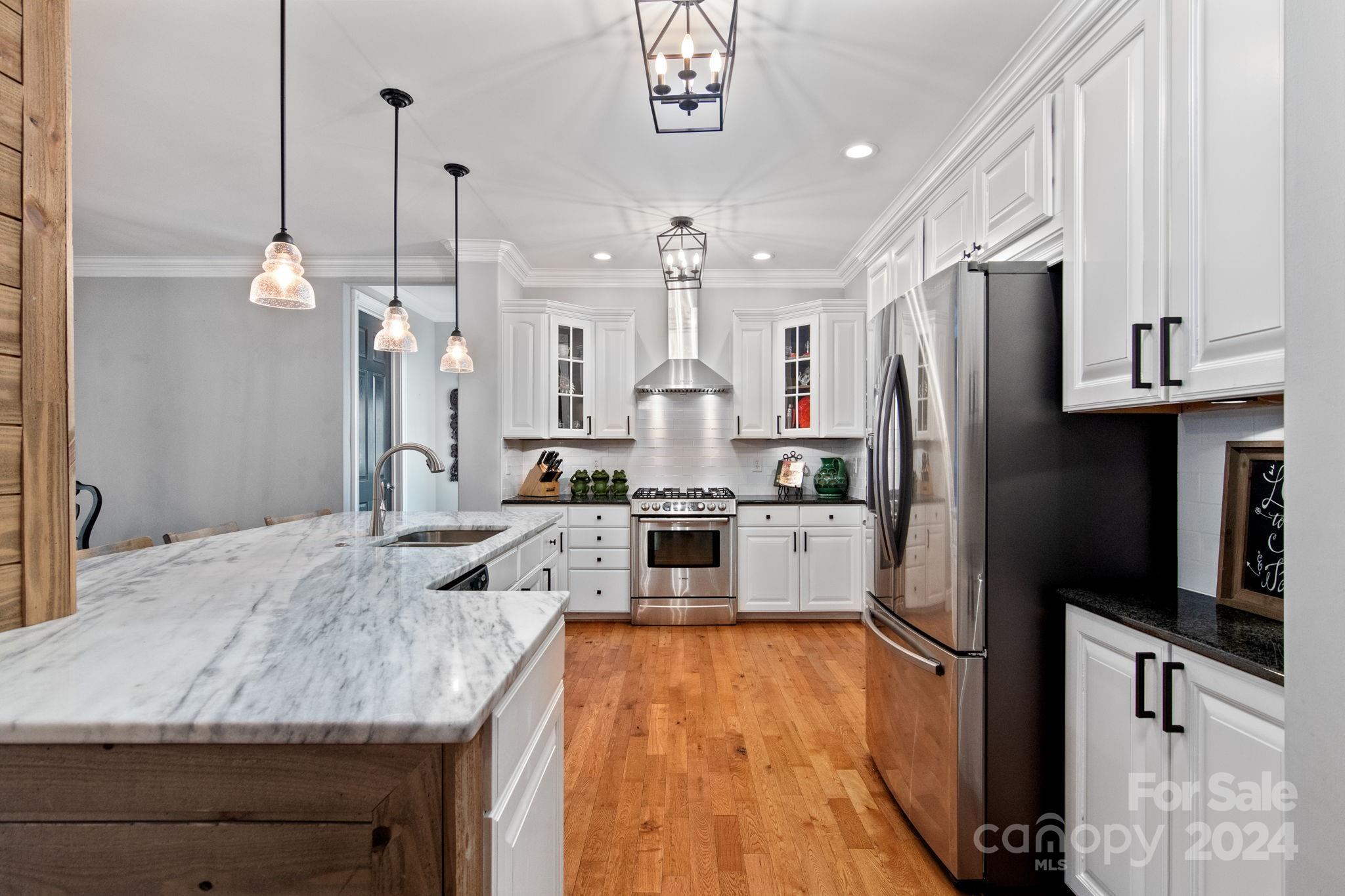 2049 Rocky Stream Road York, SC 29745 - Photo 6 of 47 a kitchen with stainless steel appliances granite countertop a sink refrigerator and microwave
