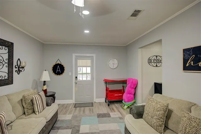 a living room with furniture rug and window