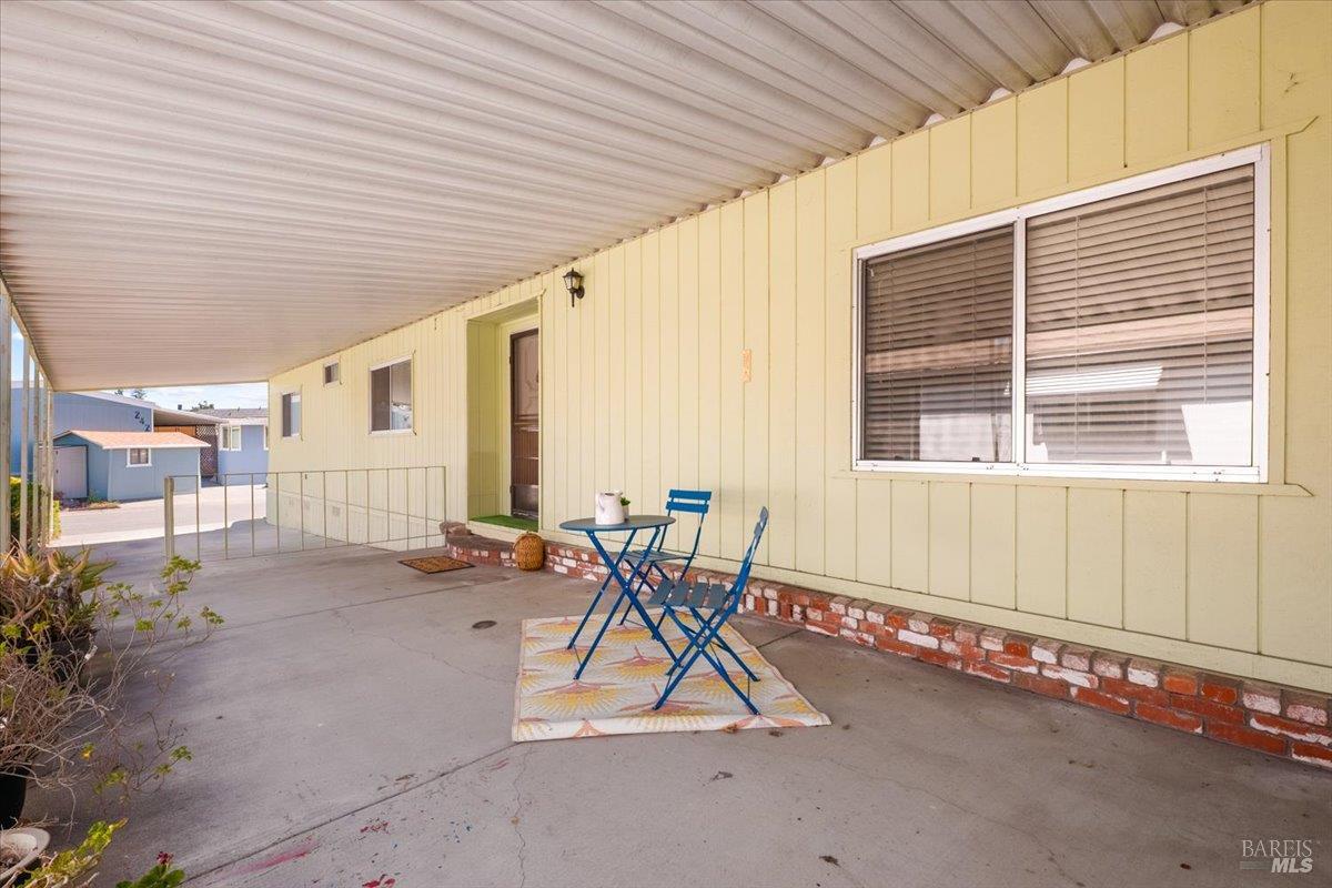 243 Parque Cabana Rohnert Park, CA 94928 - Photo 3 of 26 a view of a patio with table and chairs and potted plants