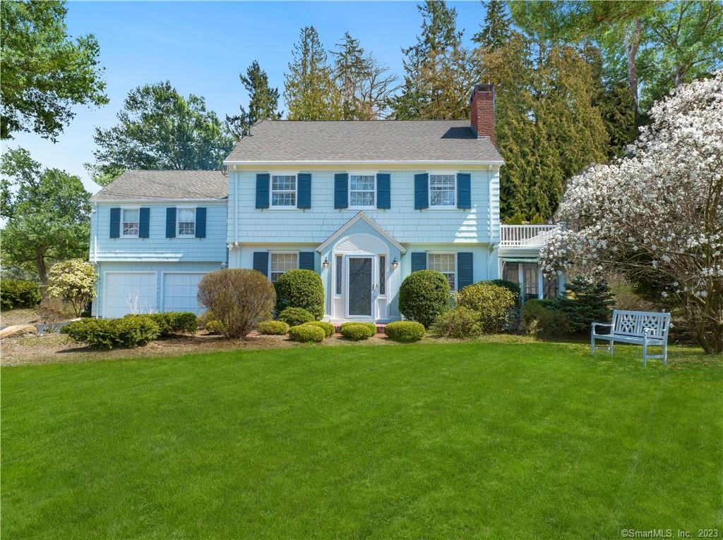 39 Wepawaug Road Woodbridge, CT 06525 - Photo 1 of 1 a front view of a house with a yard