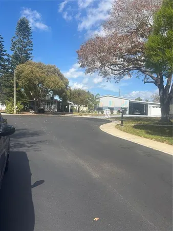 a view of a city street with a building in the background