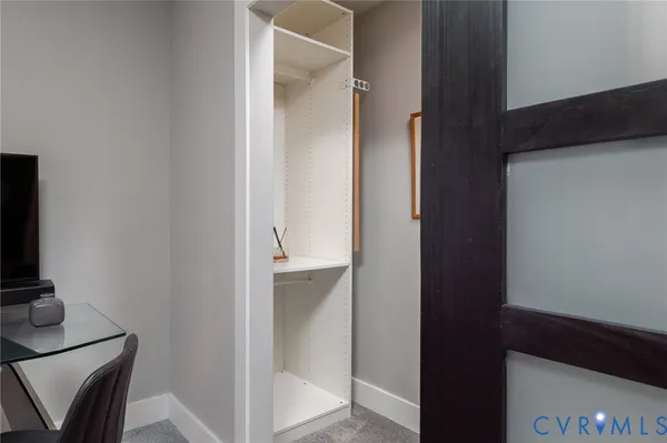 a bathroom with a granite countertop sink a mirror and vanity