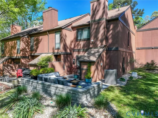 a view of a backyard with large trees