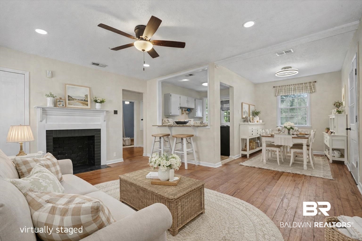 5117 Norton Lane Mobile, AL 36608 - Photo 3 of 35 Living room with light wood-type flooring, a brick fireplace, and a ceiling fan