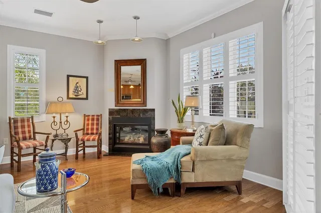 a kitchen with a stove a sink a dining table and chairs